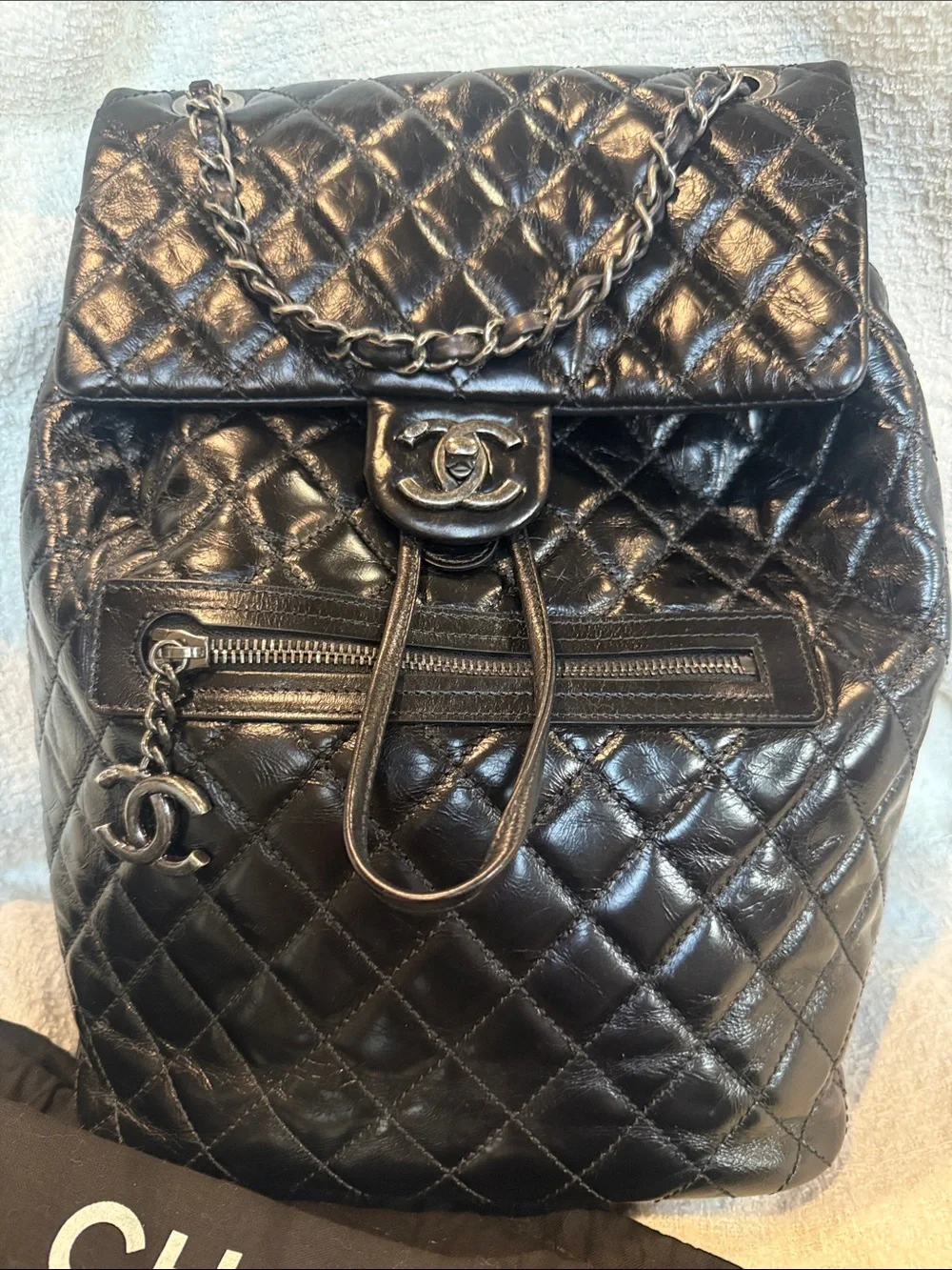 CHANEL Black Quilted Lambskin Drawstring Backpack with Chain